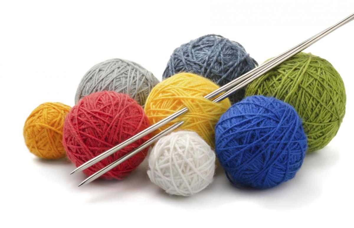Balls of yarn and knitting needles